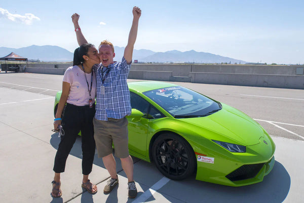 man in front of supercar