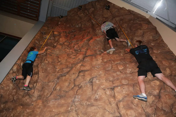 boy rock climbing