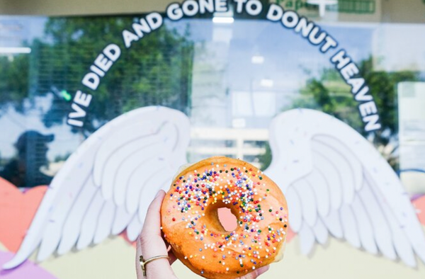 donut in front of santa monica sign