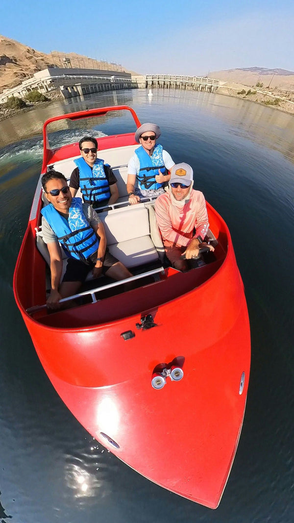 driving red boat with view