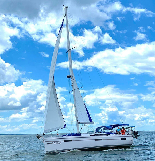 sailboat anchored in bay