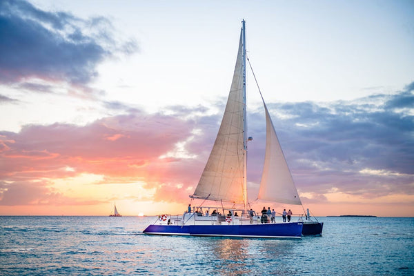 boat sailing at sunset