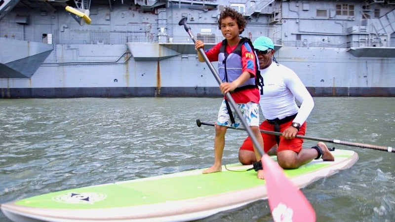 child-paddle-boarding