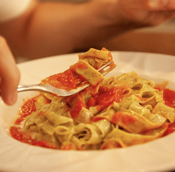 putting pasta through maker