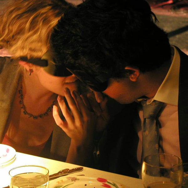 people eating with blindfolds