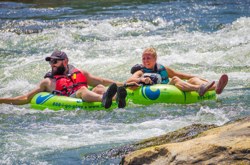 couple-white-water-tubing