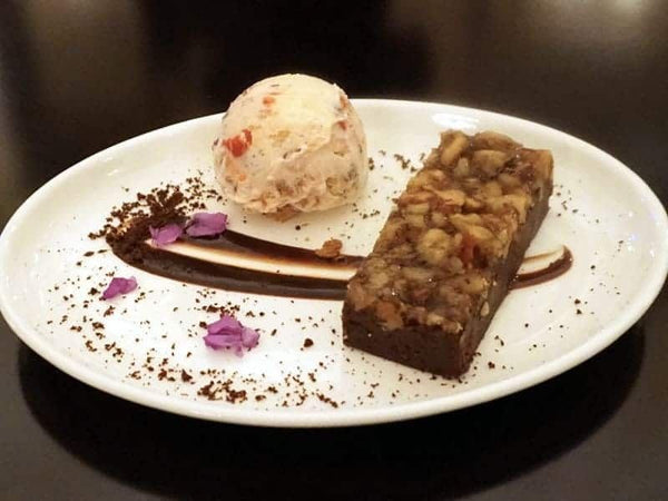 deep dish pizza being cut