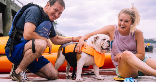 owner with dog paddling