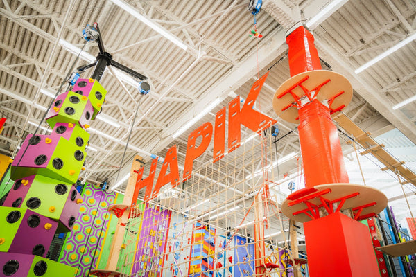 family enjoying snacks at climbing gym