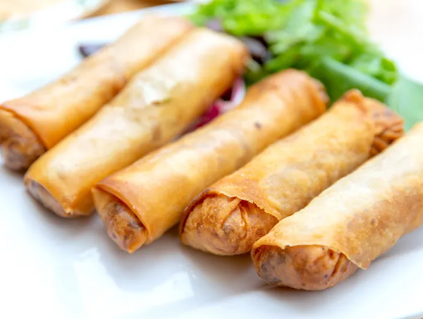 Chef and student in sushi class group.jpg