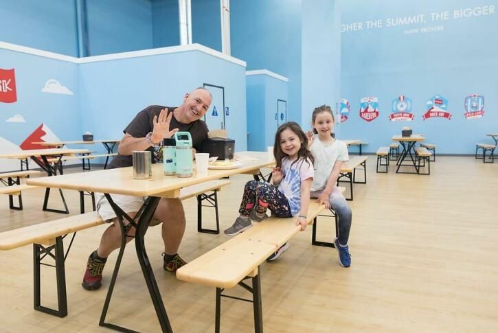 family-enjoying-snacks-at-climbing-gym