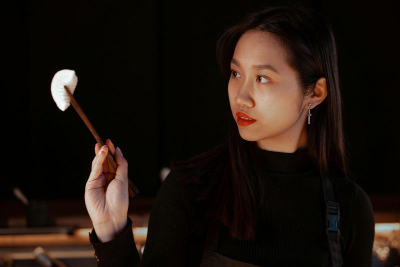 feeding-dumpling-with-chop-stick