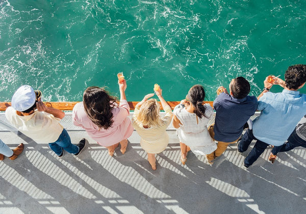 couple pouring champagne on a brunch cruise