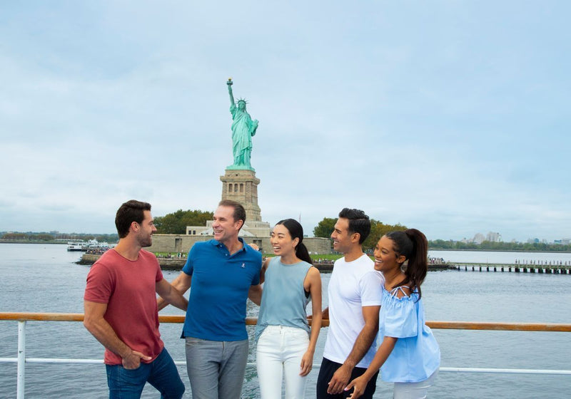 friends-on-a-lunch-cruise-with-statue-of-liberty