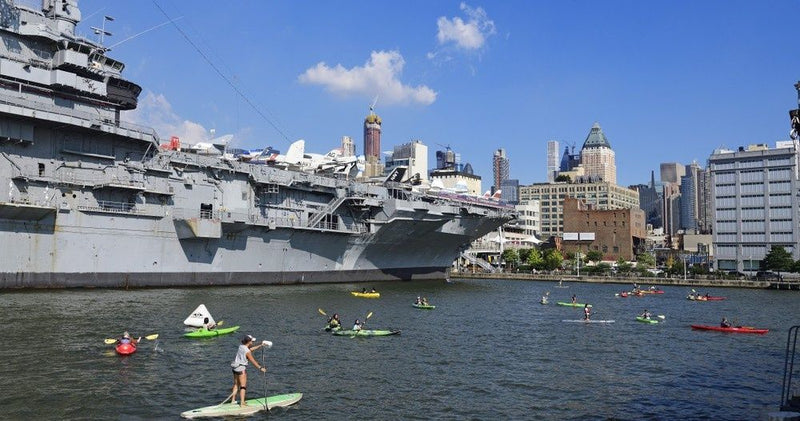 group-of-kayakers-and-paddle-boarders