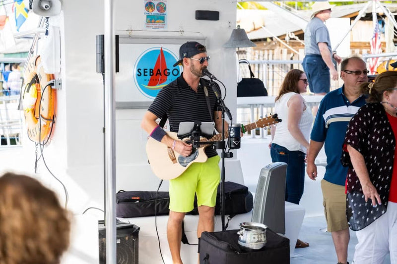 guy-singing-on-a-boat