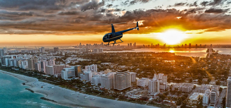 helicopter-over-florida-beach-at-sunset