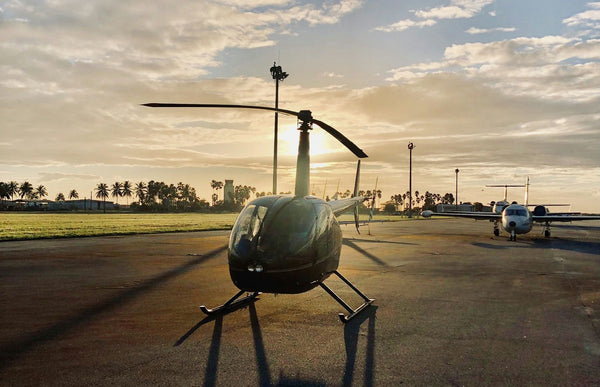 helicopter over purple sunset