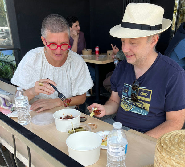 man and woman eating food on tour.jpg