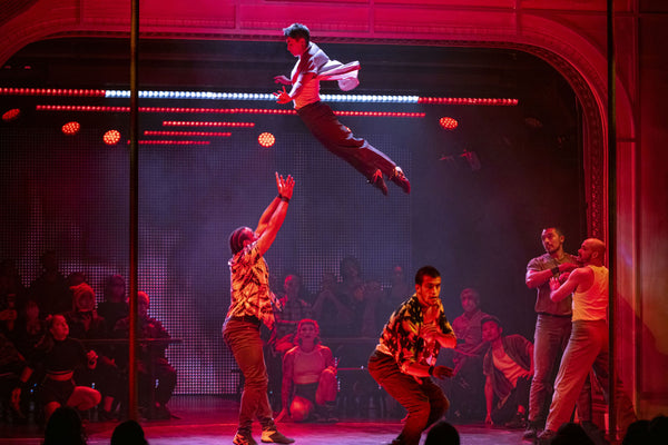 man tossing another man