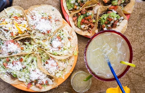Mexican food and margaritas on table