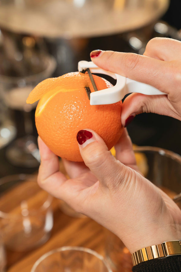 woman pouring red cocktail