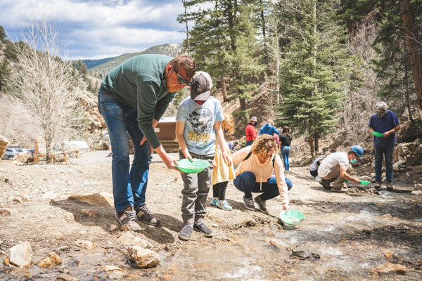 people sifting in river for gold.jpg