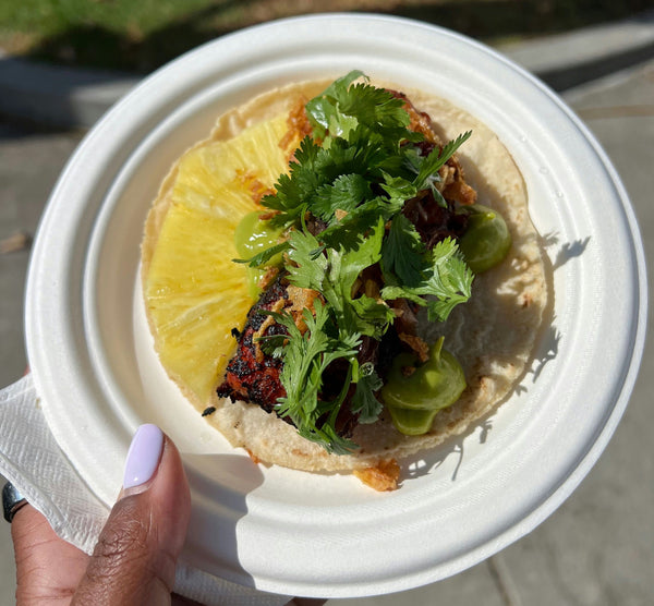 man and woman eating food on tour.jpg