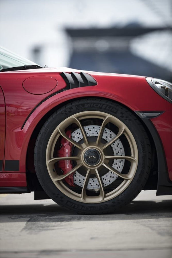 lime green porsche driving