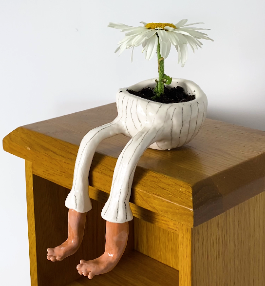 group of girls making pottery