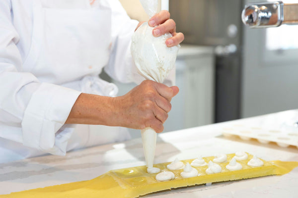 Chef adding cheese to plate.jpg