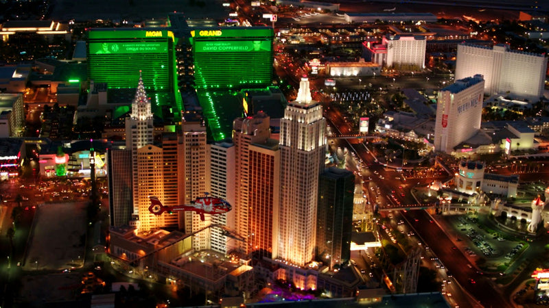 red-heli-flying-over-las-vegas-strip-at-night-jpg