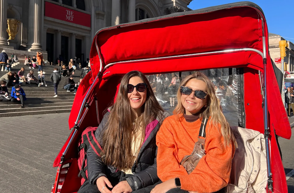 girls sitting on famous stairs