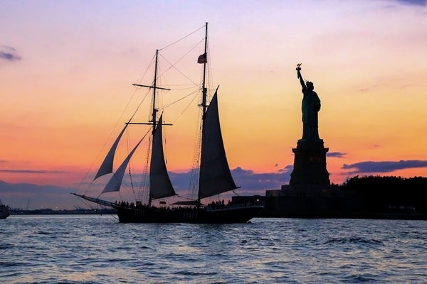 sailboat with statue of liberty