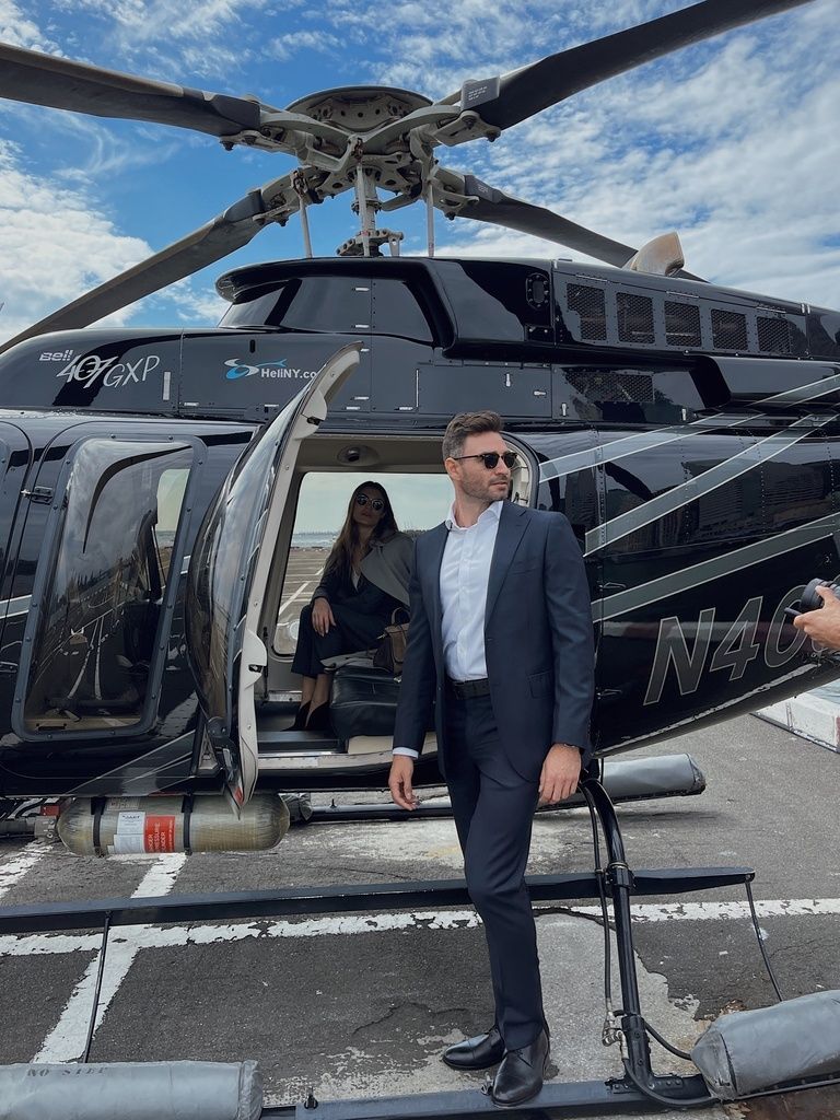 sharp-dressed-man-getting-on-a-helicopter