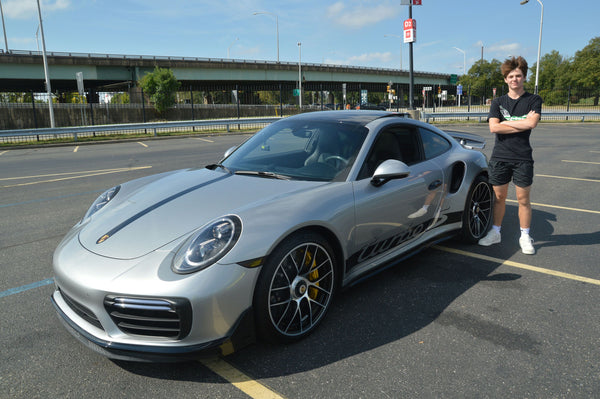 green sports car and family