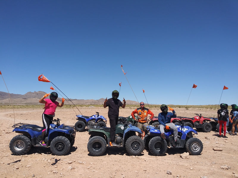 standing-on-atvs-in-desert
