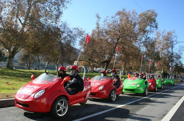 Family in fornt of merry go round.png