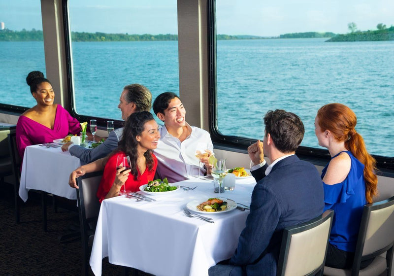 two-couple-enjoying-lunch-together-on-a-scenic-cruise