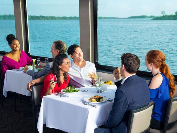 lunch cruise with statute of liberty background