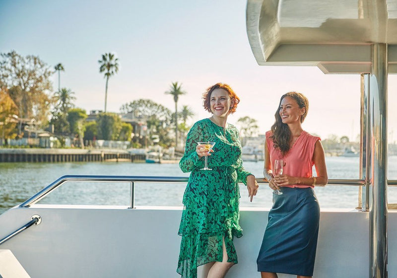 two-women-posing-for-a-photo-on-a-brunch-cruise