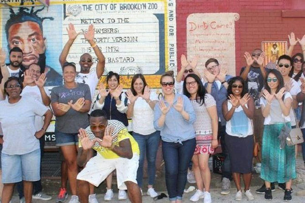 group photo with street art
