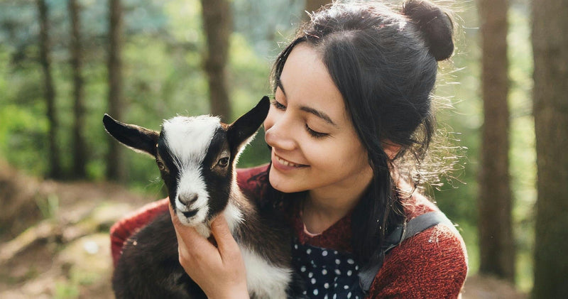 woman-cuddling-goat-jpeg