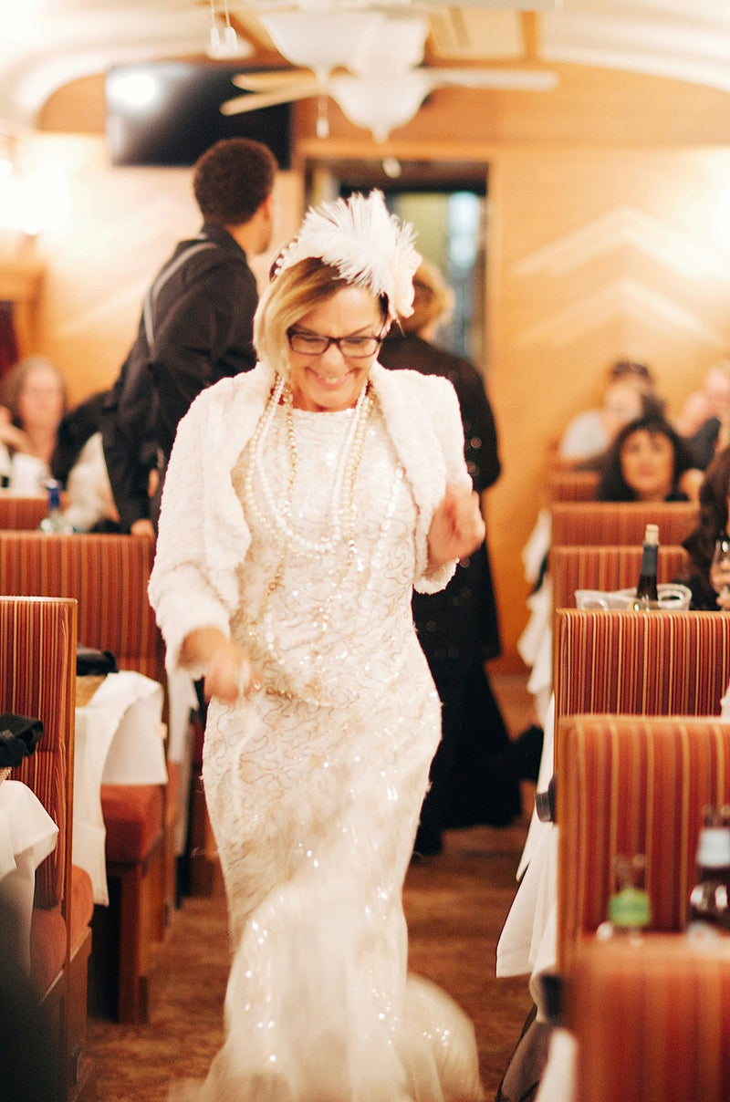 woman-on-train-in-white-gown