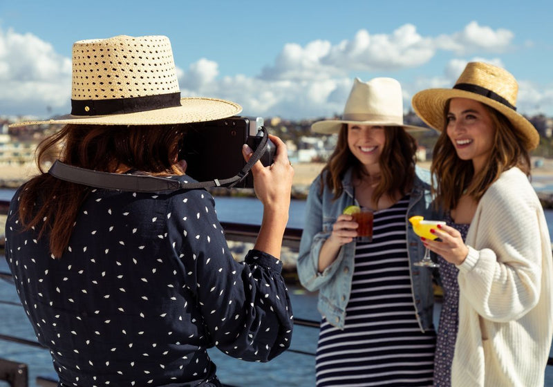 woman-taking-photo-of-friends