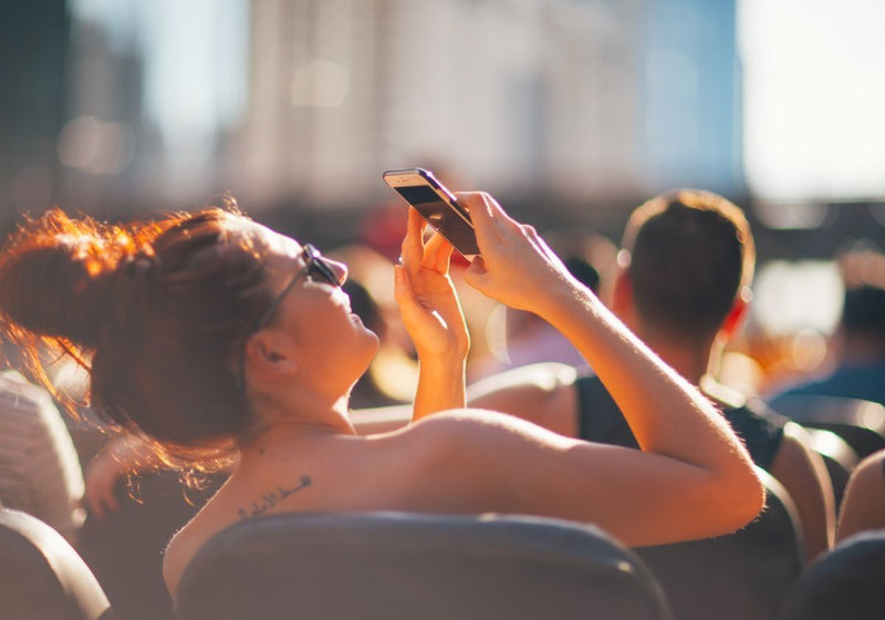 woman-taking-picture-of-architecture-on-river-lake-architectural-tour
