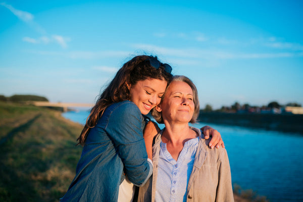 mum and daughter hugging
