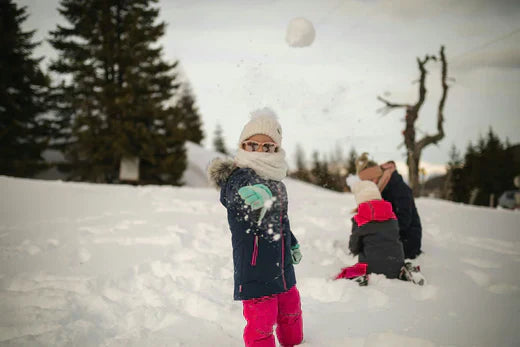 girl throwing a snowball