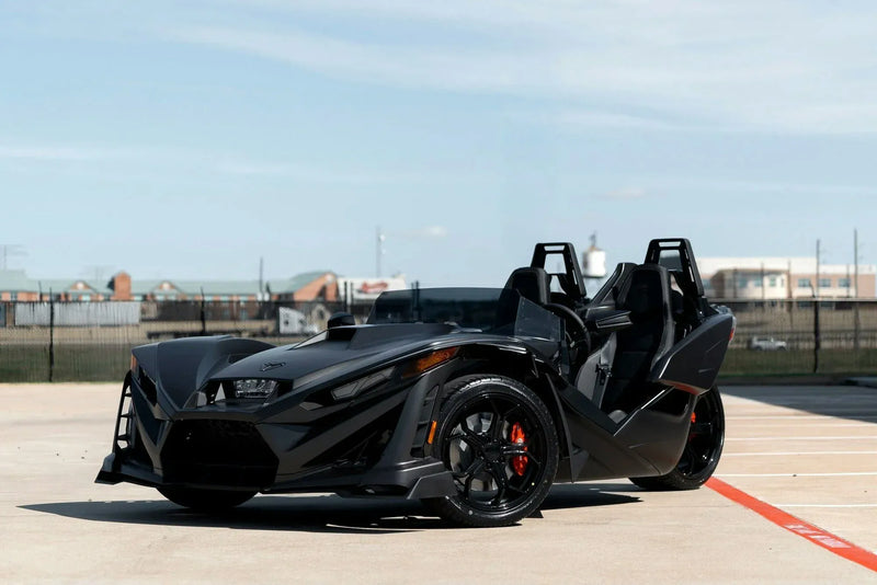 1-day-polaris-slingshot-rental-houston-black-front-quarter-parking-lot.webp