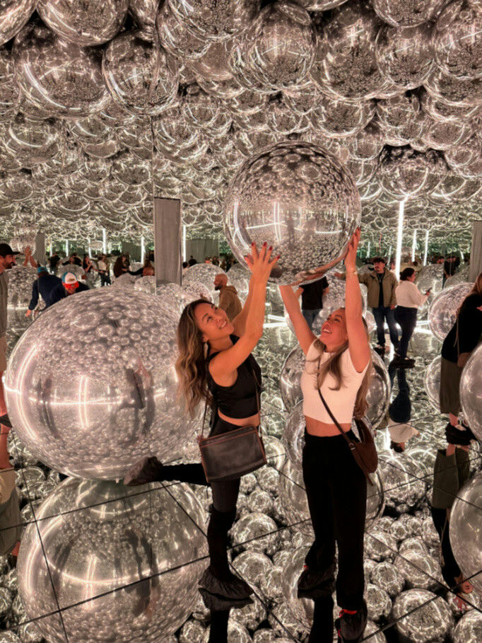 2 girls in bubble room.png
